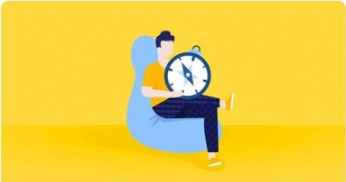 Man sitting on a bean bag with a compass